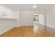 Bright living room features hardwood floors and a pass-through bar into kitchen area at 4346 Rayfield Dr # 4346, Sarasota, FL 34243