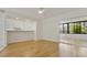 Open-concept living area with bar stool seating and sliding glass doors leading to the sunroom at 4346 Rayfield Dr # 4346, Sarasota, FL 34243
