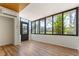 Inviting sunroom with beautiful laminate flooring and large windows providing natural light at 4346 Rayfield Dr # 4346, Sarasota, FL 34243