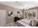 Bright bedroom with backyard pool views, plantation shutters, and a desk at 523 Saint Girons Ct, Punta Gorda, FL 33950
