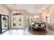Spacious dining room with chandelier and access to the front door at 523 Saint Girons Ct, Punta Gorda, FL 33950