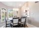 Spacious dining room with chandelier and lots of natural light at 523 Saint Girons Ct, Punta Gorda, FL 33950