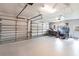 Spacious three car garage featuring epoxy flooring and ample storage space at 523 Saint Girons Ct, Punta Gorda, FL 33950