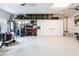 Well-organized garage with storage solutions, cabinets, shelving, and ample space for parking and projects at 523 Saint Girons Ct, Punta Gorda, FL 33950
