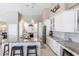 Modern kitchen with a large central island, abundant countertop space, and stainless steel appliances for culinary enthusiasts at 523 Saint Girons Ct, Punta Gorda, FL 33950