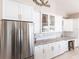 Close up of the bright kitchen with white cabinetry and stainless steel appliances at 523 Saint Girons Ct, Punta Gorda, FL 33950