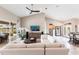 Spacious living room with tall ceilings, neutral decor, and large sliding glass doors providing an abundance of natural light at 523 Saint Girons Ct, Punta Gorda, FL 33950