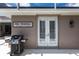 Outdoor kitchen area with grill, and a sign reading 'Free Moorings' at 523 Saint Girons Ct, Punta Gorda, FL 33950