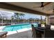 Covered patio with view of screened pool and waterfront canal at 523 Saint Girons Ct, Punta Gorda, FL 33950