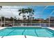 This screened pool offers stunning water views and a serene atmosphere for relaxation and enjoying the waterfront lifestyle at 523 Saint Girons Ct, Punta Gorda, FL 33950