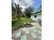 Spacious backyard with lush green grass and a charming outdoor patio area, perfect for relaxation at 5727 Beechwood St, Punta Gorda, FL 33982