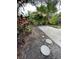 Landscaped backyard with stepping stones and lush foliage for a serene outdoor living space at 5727 Beechwood St, Punta Gorda, FL 33982