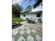Outdoor patio area with a dining set, offering a delightful spot for entertaining and relaxation at 5727 Beechwood St, Punta Gorda, FL 33982
