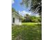 Spacious backyard with lush lawn and shaded areas for outdoor enjoyment at 5727 Beechwood St, Punta Gorda, FL 33982