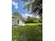 Spacious backyard with lush lawn and shaded areas for outdoor enjoyment at 5727 Beechwood St, Punta Gorda, FL 33982