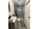 Modern bathroom featuring stylish shower with glass door and tiled walls at 5727 Beechwood St, Punta Gorda, FL 33982