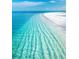 Crystal-clear turquoise water and white sandy beach, creating a tropical paradise setting at 5727 Beechwood St, Punta Gorda, FL 33982