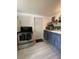 Well-lit kitchen showcases stainless steel appliances and functional storage solutions at 5727 Beechwood St, Punta Gorda, FL 33982
