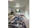 Stylish living room with tile floors, a cozy area rug, and comfortable seating, perfect for relaxing and unwinding at 5727 Beechwood St, Punta Gorda, FL 33982