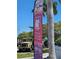 Military Heritage Museum shown with a vintage army truck display alongside the flagpole at 5727 Beechwood St, Punta Gorda, FL 33982