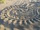 Detailed sand art featuring intricate patterns and textures, showing creativity on the beach at 5727 Beechwood St, Punta Gorda, FL 33982