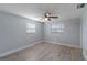 Unfurnished bedroom featuring new floors, ceiling fan, and window at 711 Forest Hill Nw Ln, Port Charlotte, FL 33948