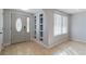 Bright foyer featuring tile flooring, stylish wall niches, and a decorative front door at 711 Forest Hill Nw Ln, Port Charlotte, FL 33948