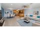 Open-concept living space featuring tile flooring, a ceiling fan, and an eat-in kitchen at 711 Forest Hill Nw Ln, Port Charlotte, FL 33948