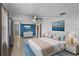 Spacious main bedroom with ceiling fan, bright walls, and tiled floor at 711 Forest Hill Nw Ln, Port Charlotte, FL 33948