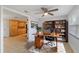 Comfortable office featuring wood desk, ceiling fan, and built in bookshelves at 711 Forest Hill Nw Ln, Port Charlotte, FL 33948