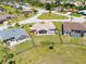 An aerial view reveals the property's spacious backyard, complete with a screened-in patio and fenced-in area at 7334 N Tulip Tree, Punta Gorda, FL 33955