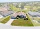An aerial view of a single Gathering home in a neighborhood with green lawn at 7334 N Tulip Tree, Punta Gorda, FL 33955