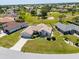 An aerial view of a single Gathering home in a neighborhood with green lawn at 7334 N Tulip Tree, Punta Gorda, FL 33955