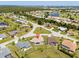 Aerial view of the house, highlighting its location in a neighborhood with mature trees and proximity to community amenities at 7334 N Tulip Tree, Punta Gorda, FL 33955