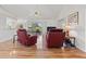 Bright living room with hardwood floors, neutral paint, and ceiling fan at 7334 N Tulip Tree, Punta Gorda, FL 33955