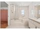 Bright main bathroom featuring a large soaking tub and a separate shower at 7334 N Tulip Tree, Punta Gorda, FL 33955