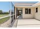 Enclosed patio area that includes windows overlooking the grassy backyard and is perfect for outdoor relaxation and enjoying nature at 7334 N Tulip Tree, Punta Gorda, FL 33955