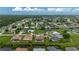 Expansive aerial view of a neighborhood with lush landscaping and a home with a screened pool at 7512 Pon Kan, Punta Gorda, FL 33955
