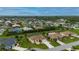 Wide aerial view of a residential neighborhood with single Gathering homes and tropical landscaping at 7512 Pon Kan, Punta Gorda, FL 33955
