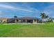 Spacious yard features a screened pool, a covered lanai, and plenty of space to play at 7512 Pon Kan, Punta Gorda, FL 33955