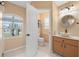 Bathroom featuring a vessel sink, arched window, and tiled floor at 7512 Pon Kan, Punta Gorda, FL 33955