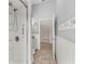 The bathroom features a glass door shower, a toilet, and white wainscoting at 7512 Pon Kan, Punta Gorda, FL 33955