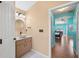 Bathroom with vanity and view into turquoise bedroom at 7512 Pon Kan, Punta Gorda, FL 33955