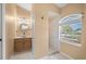 Full bathroom featuring a vessel sink, mirror and access to a walk in shower at 7512 Pon Kan, Punta Gorda, FL 33955