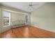 Bright, empty bedroom with hardwood floors, vaulted ceilings and natural light at 7512 Pon Kan, Punta Gorda, FL 33955