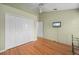 This bedroom offers a spacious closet, ceiling fan, and mounted television at 7512 Pon Kan, Punta Gorda, FL 33955