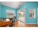 Bedroom featuring sliding glass doors to outdoor pool area and brightly painted walls at 7512 Pon Kan, Punta Gorda, FL 33955