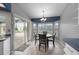 Bright breakfast nook with large windows and sliding door access to a screened patio at 7512 Pon Kan, Punta Gorda, FL 33955