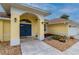 Close up of the front entrance with a double front door and decorative rock landscaping at 7512 Pon Kan, Punta Gorda, FL 33955