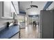 Well-lit kitchen with stainless steel appliances, blue countertops, and an adjacent breakfast nook at 7512 Pon Kan, Punta Gorda, FL 33955